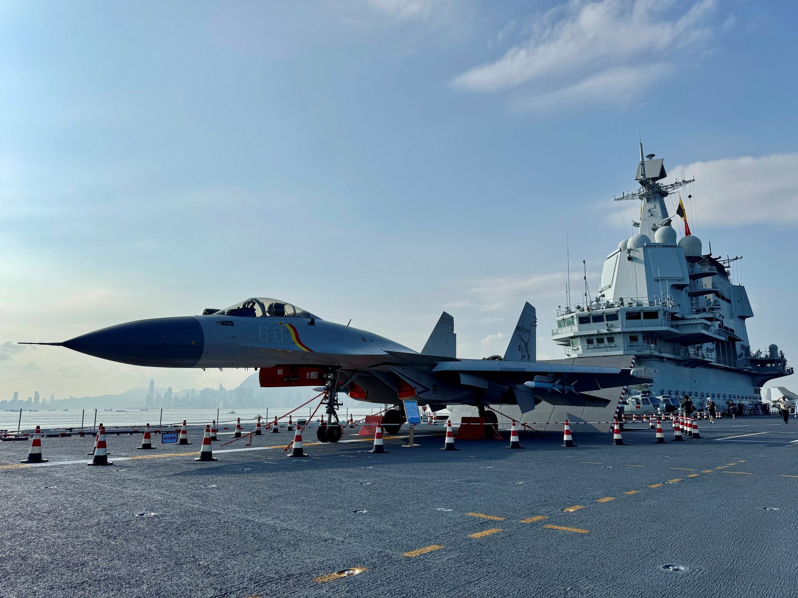 China reveals with western aircraft carrier in contested waters